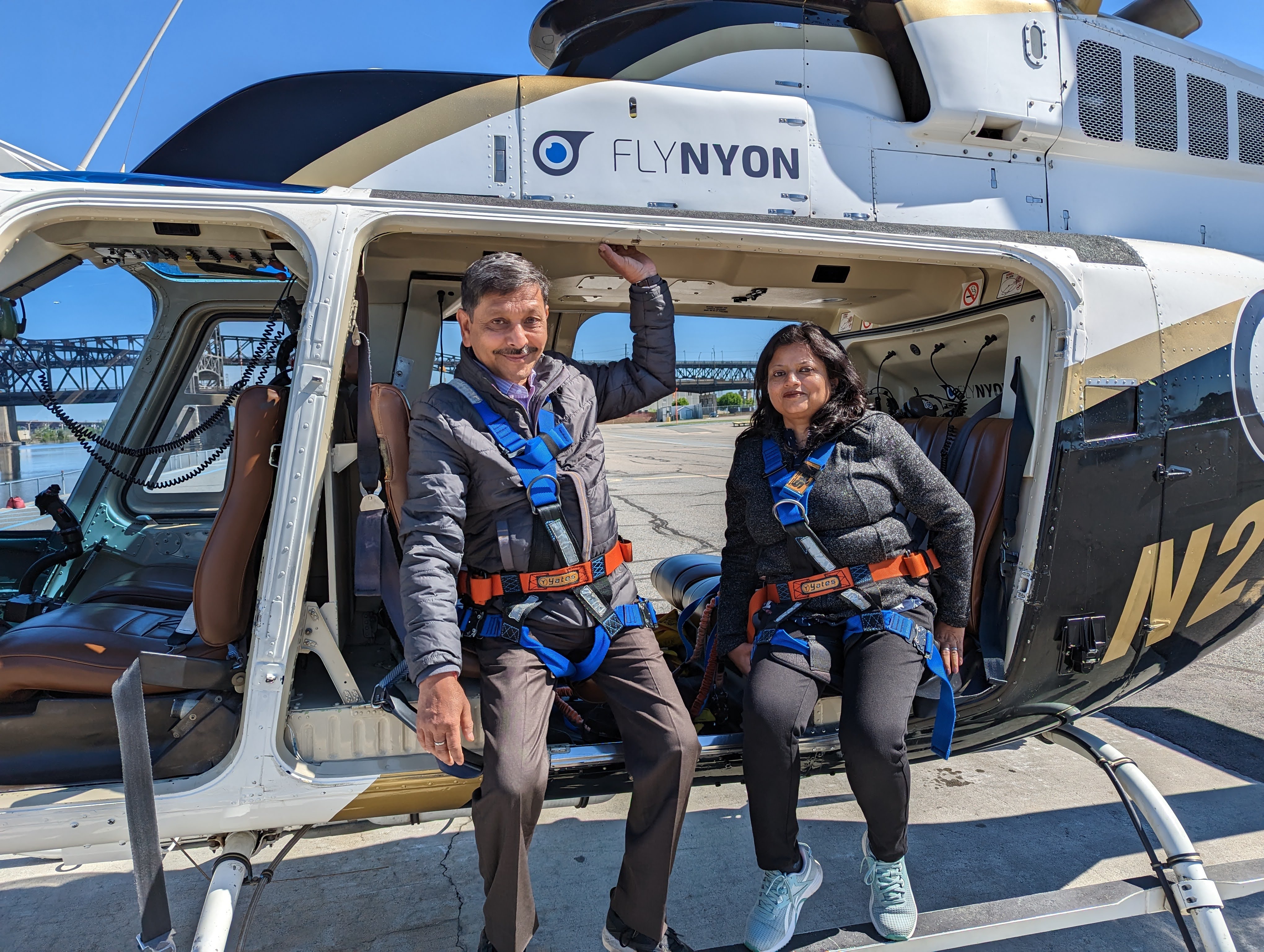 Parents on a doors-off helicopter ride